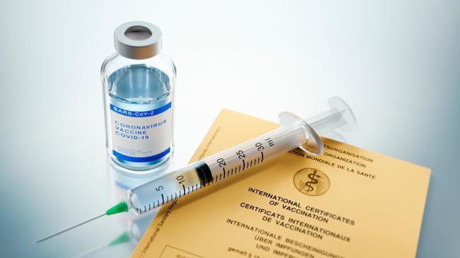refer to: Proof of vaccination within the meaning of the Infection Protection Act (IfSG) COVID-19 Vaccine with vaccination certificate (Source: PeterSchreiberMedia/Shutterstock.com) (refer to: Proof of vaccination within the meaning of the Infection Protection Act (IfSG))