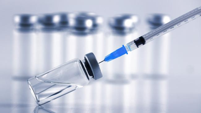 refer to: Current Information on the Availability of Flu Vaccines in Germany Vaccine syringe and ampoules in the background